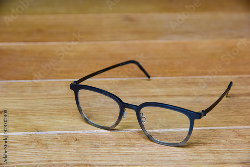 Clear eye glasses,Glasses transparent dark blue frame vintage style on wood background