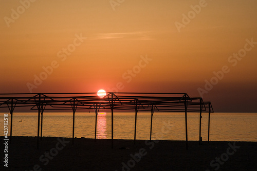 Sun ball at sunset on the city beach