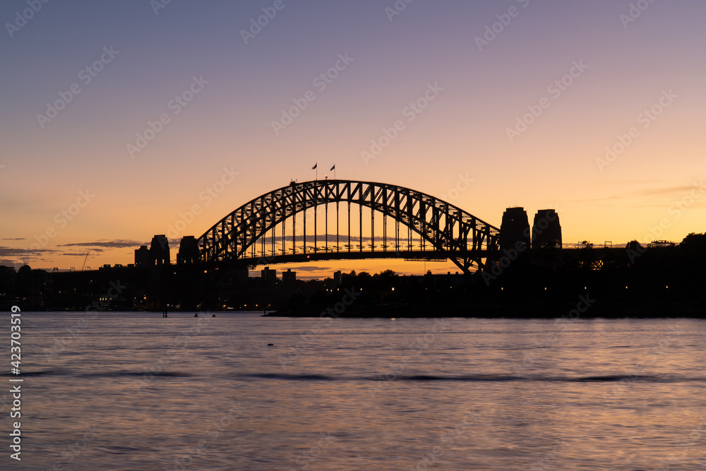 Naklejka premium Silhouette of Sydney Harbour Bridge at dawn.