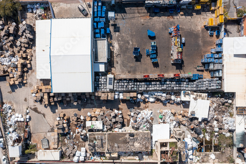 Large scrapyard with piles of sorted metals, Aerial view. © STOCKSTUDIO
