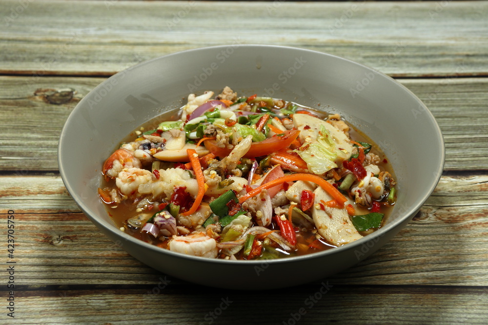Traditional spicy mixed salad serving on the plate. Famous appetizer menu in Asian restaurant. Traditional spicy mixed salad serving on the plate. Famous appetizer menu in Asian restaurant.