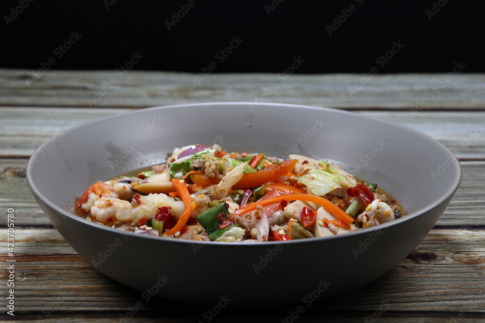 Traditional spicy mixed salad serving on the plate. Famous appetizer menu in Asian restaurant. Traditional spicy mixed salad serving on the plate. Famous appetizer menu in Asian restaurant.