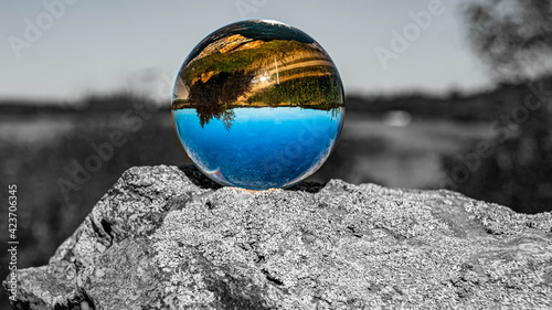 Crystal ball landscape shot with black and white background outside the sphere at Bad Griesbach, Bavaria, Germany