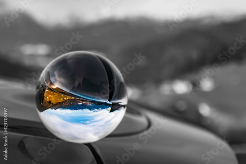 Crystal ball alpine landscape shot with black and white background outside the sphere near Berchtesgaden, Bavaria, Germany © Martin Erdniss