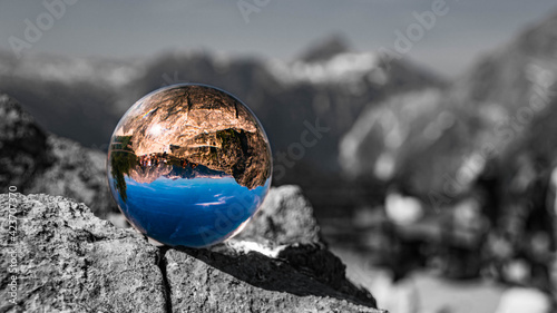 Crystal ball alpine landscape shot with black and white background outside the sphere at the famous Jenner summit, Berchtesgaden, Bavaria, Germany © Martin Erdniss