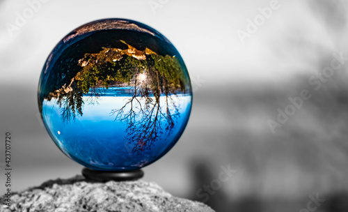 Crystal ball alpine landscape shot with black and white background outside the sphere at the famous Kampenwand, Aschau im Chiemgau, Bavaria, Germany © Martin Erdniss