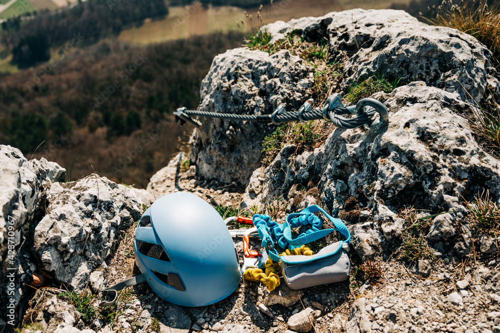 Ferrata climbing equipment. Via Ferrata set with two lanyards with carabiners, helmet with the