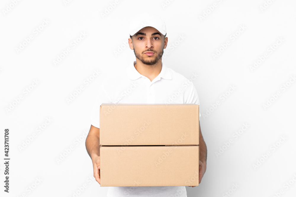 Delivery Arabian man isolated on blue background keeping arms crossed