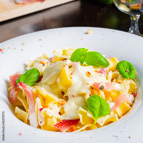 Tagliatelle with gorgonzola masarpone sauce and ham. photo