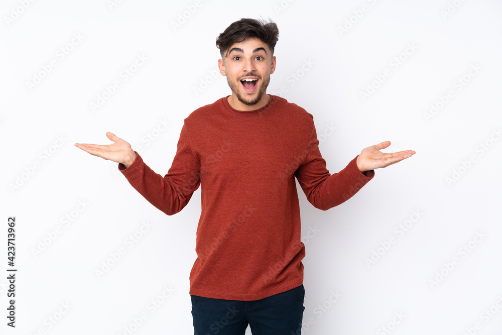 Arabian handsome man over isolated background with shocked facial expression Arabian handsome man over isolated background with shocked facial expression