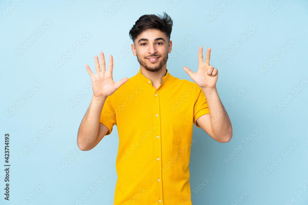 Arabian handsome man over isolated background counting eight with fingers Arabian handsome man over isolated background counting eight with fingers