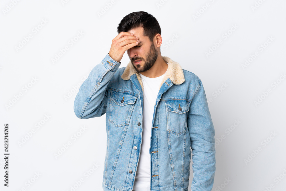 Young handsome man with beard isolated on white background with headache Young handsome man with beard isolated on white background with headache