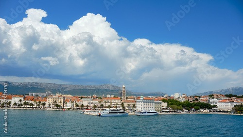 Split City Harbor from upper deck of large sea ferry boat. Sea, passenger ship, city skyline with mountains.