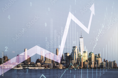 Double exposure of abstract creative financial chart and upward arrow illustration on New York city skyscrapers background, research and strategy concept