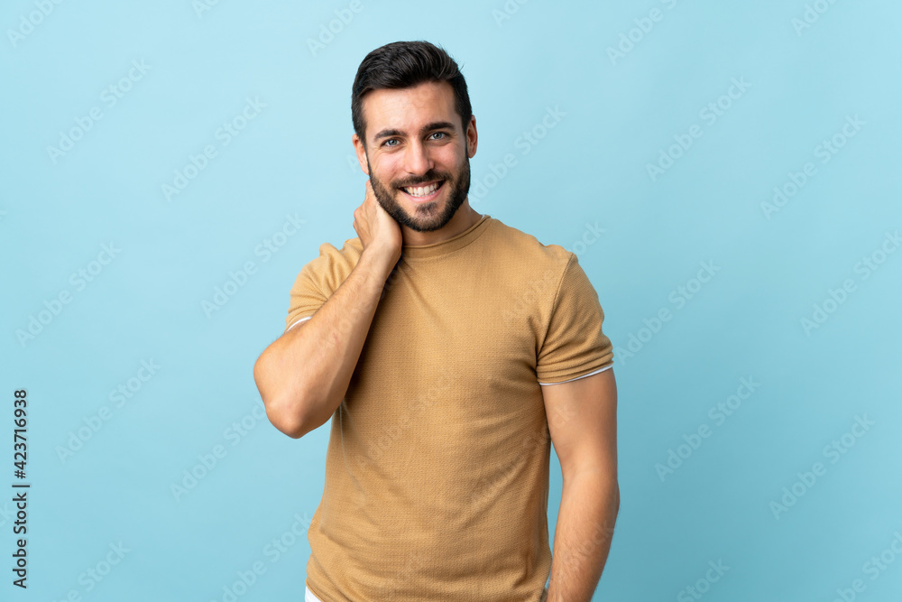 Young handsome man with beard over isolated background laughing Young handsome man with beard over isolated background laughing