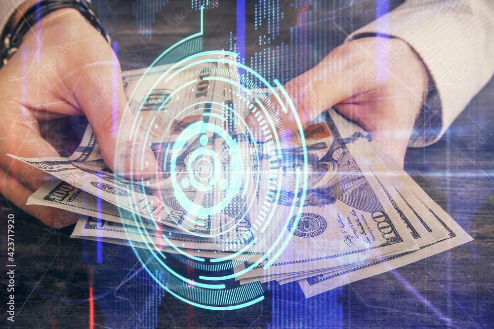 Multi exposure of technology drawing hologram and us dollars bills and man hands. Data concept