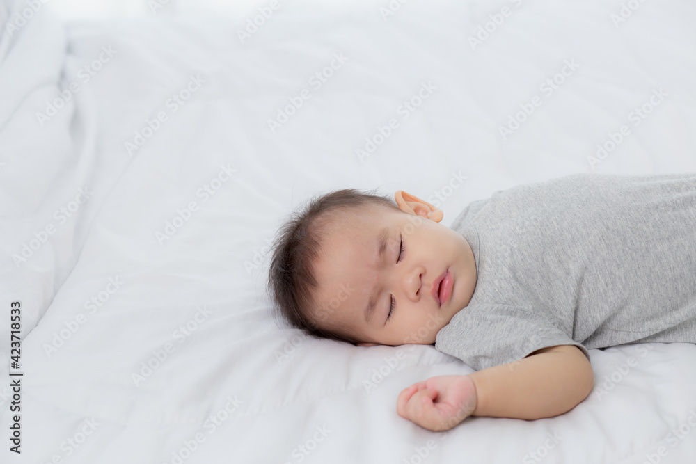 Portrait of asian little baby girl sleeping on bed in the bedroom at home, newborn napping with cozy and relax, infant innocence in bedtime, happy toddler cute, growth of child and emotion, indoors. Portrait of asian little baby girl sleeping on bed in the bedroom at home, newborn napping with cozy and relax, infant innocence in bedtime, happy toddler cute, growth of child and emotion, indoors.