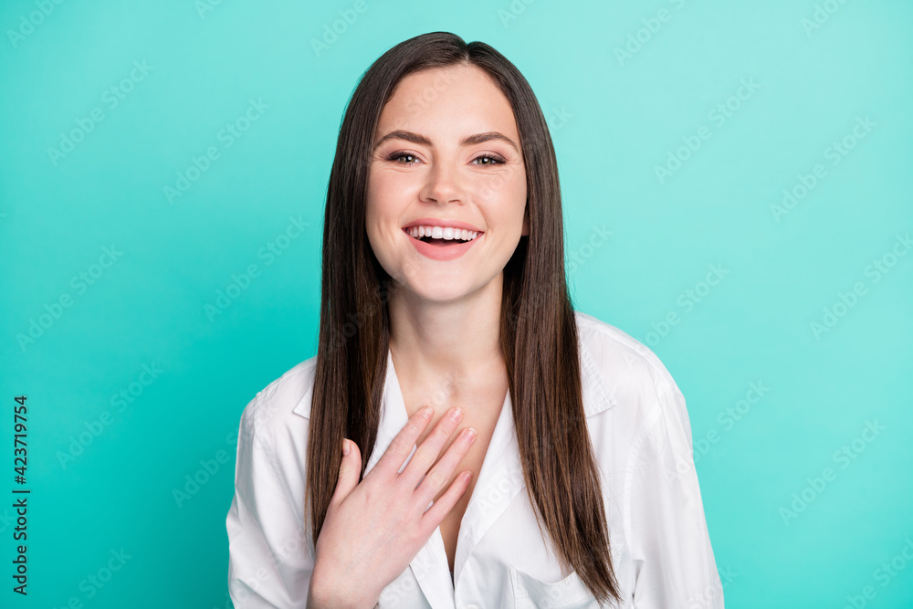 Photo of joyful positive young happy woman laugh funny joke good mood isolated on pastel teal color background Photo of joyful positive young happy woman laugh funny joke good mood isolated on pastel teal color background