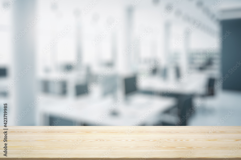 Empty wooden table top with light sunny furnished office on background, mock up Empty wooden table top with light sunny furnished office on background, mock up