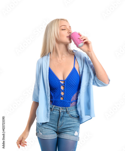 Beautiful young woman drink...