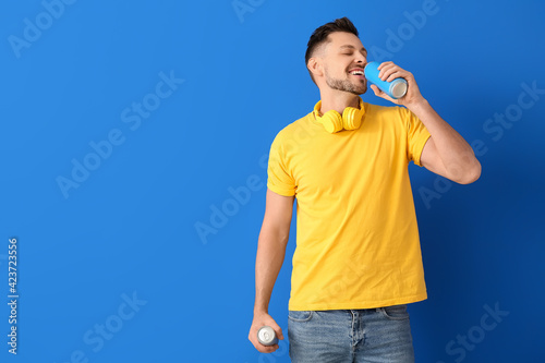 Handsome man drinking soda ...