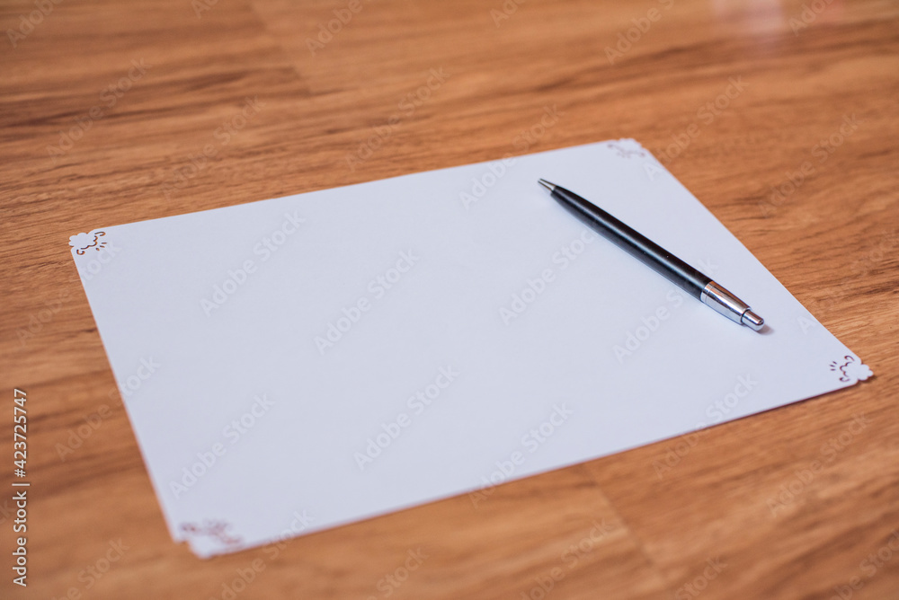 the pen is on a blank sheet of paper the pen is on a blank sheet of paper