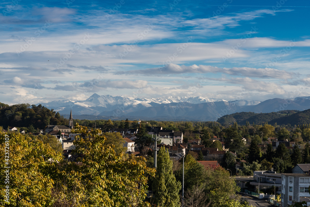 French town Pau against the winter Pyrenees mountains peaks