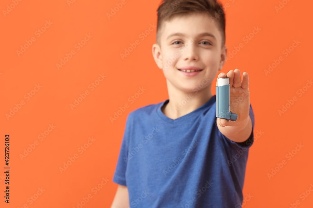 Little boy with inhaler on color background Little boy with inhaler on color background