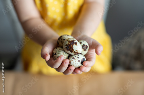 child holding easter eggs