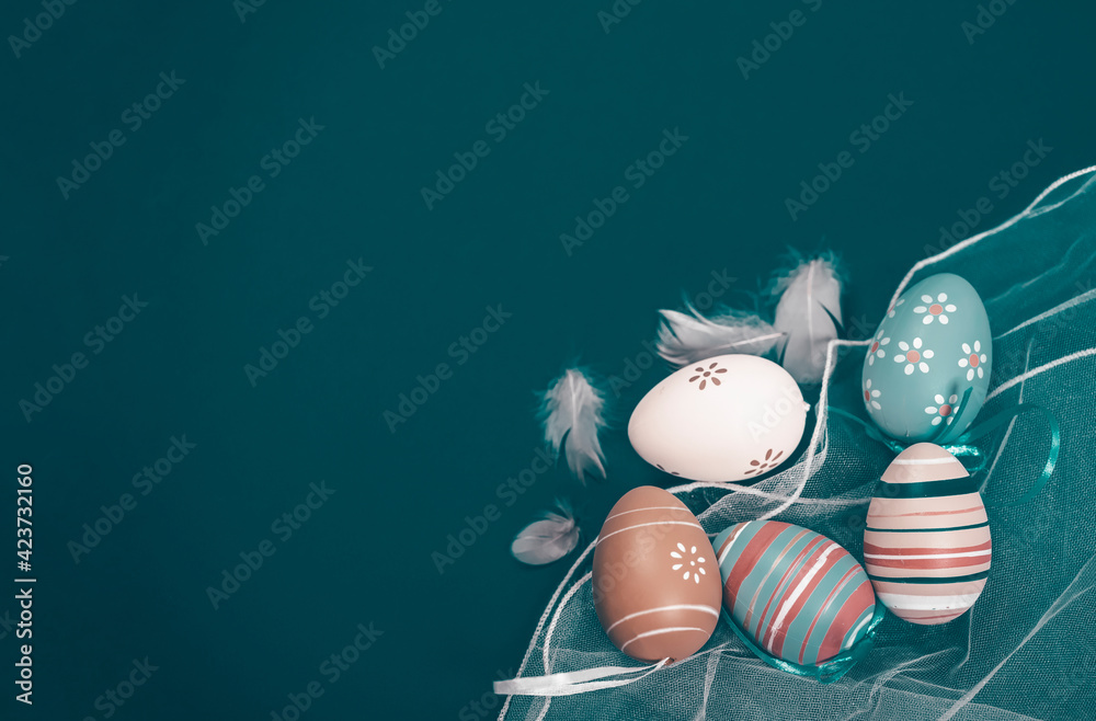 Easter background with Easter eggs. Top view with copy space. - obrazy, fototapety, plakaty 