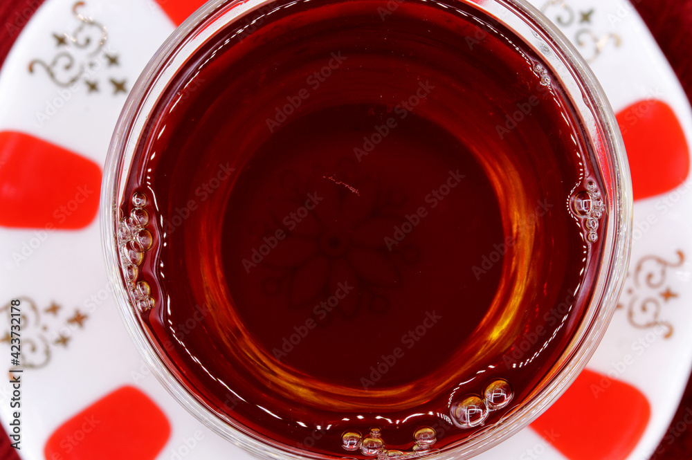 a glass  of Turkish tea on table