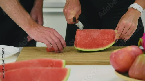 Man and woman couple in casual outfit preparing and eating healthy food for self care with happiness and joyful in modern kitchen