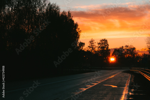 Colorful sunset on the highway. Dark, moody and calm © Janis Eglins