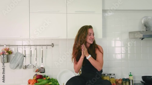Man and woman couple in casual outfit playing food to impress his girlfriend with happiness and joyful in modern kitchen