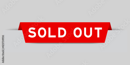 Red color inserted label with word sold out on gray background