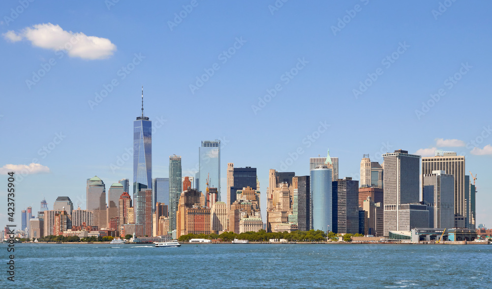 Manhattan waterfront skyline on a sunny summer day, New York City, USA.