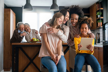 Multiethnic diverse happy family with grandparents and children at home