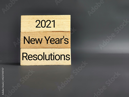 2021 New Year's Resolutions text in vintage background. Front view. Stock photo.