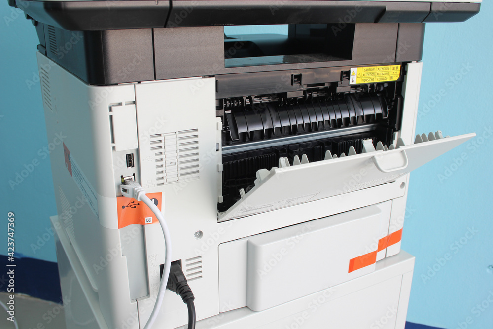 photocopier is a machine that makes paper copies of documents and other visual images ,close-up multi-function device, printer scanner, copier.