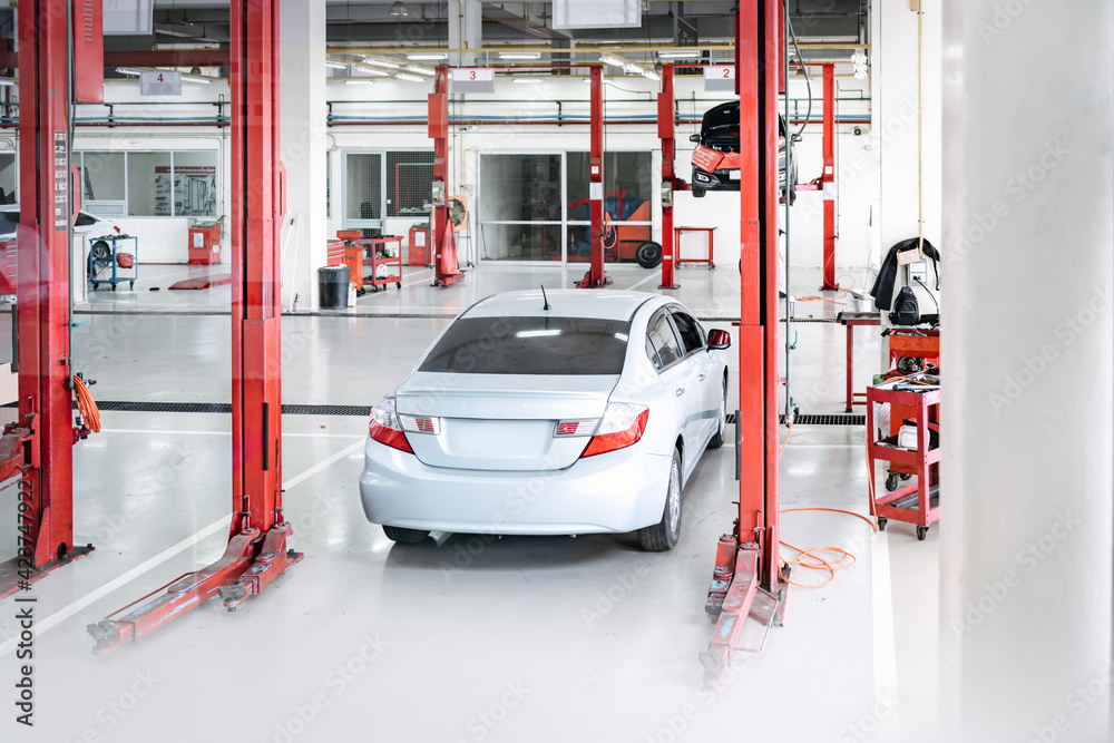Fototapeta premium Car Auto Service and Vehicle Maintenance Workshop Center, Automobile Garage Shop and Spare Part Changing. Automotive Services Station. Business Car Repair and Check Up