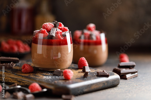 Slika na platnu Chocolate panna cotta with raspberry jelly, raspberries and chocolate pieces