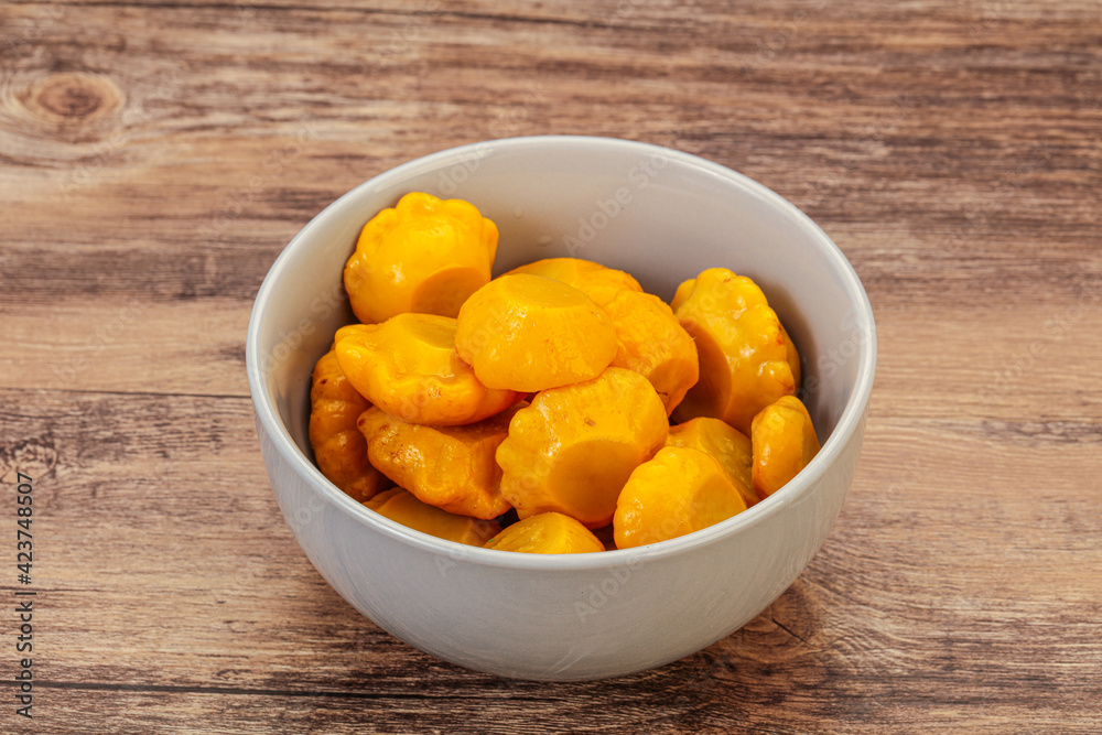 Marinated yellow patisson in the bowl Marinated yellow patisson in the bowl