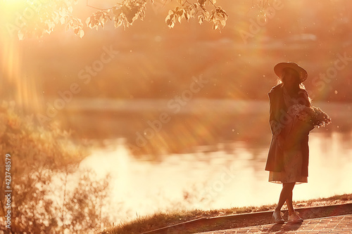 golden autumn girl portrait / happy free young girl in autumn landscape, indian summer view