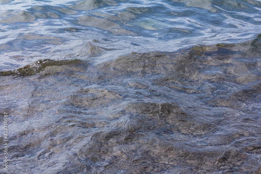 Sea surface with small waves, in blue and turquoise color tones Sea surface with small waves, in blue and turquoise color tones