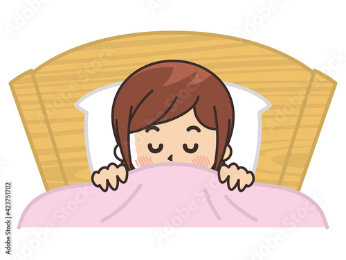 ベッドで眠る女性