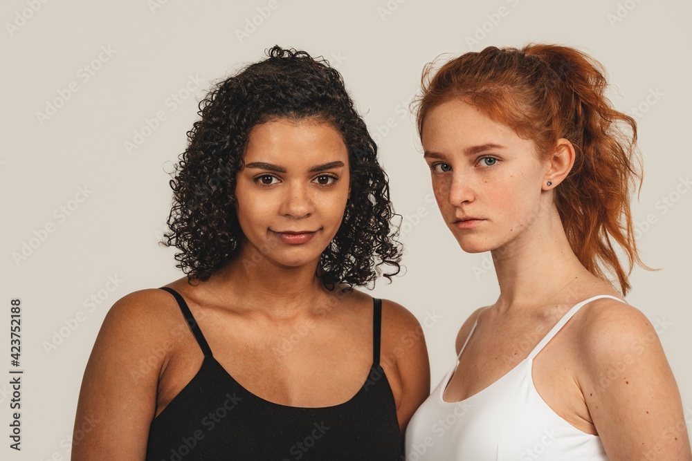 Photo of natural multiracial women, body positive. Feminist females, isolated on white background. Concept natural beauty and girl power