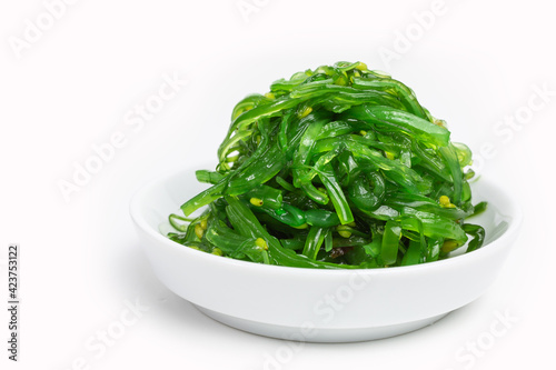 fresh green wakame seaweed salad