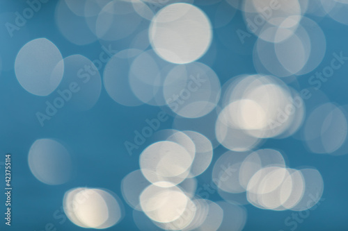 Abstract or blurry image of glitter or bokeh water of sea or ocean for background usage.