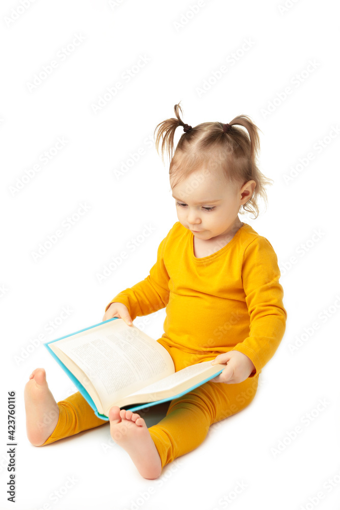 Little girl reading isolated on white. Cute baby with book Little girl reading isolated on white. Cute baby with book