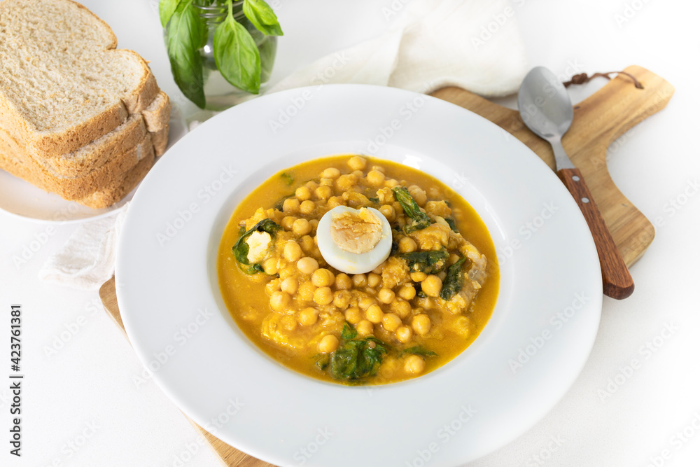 Traditional Spanish cuisine dish that is eaten mainly during the Holy Week holidays. Chickpea, cod, spinach and egg soup. Vigil Potaje. Traditional Spanish cuisine dish that is eaten mainly during the Holy Week holidays. Chickpea, cod, spinach and egg soup. Vigil Potaje.